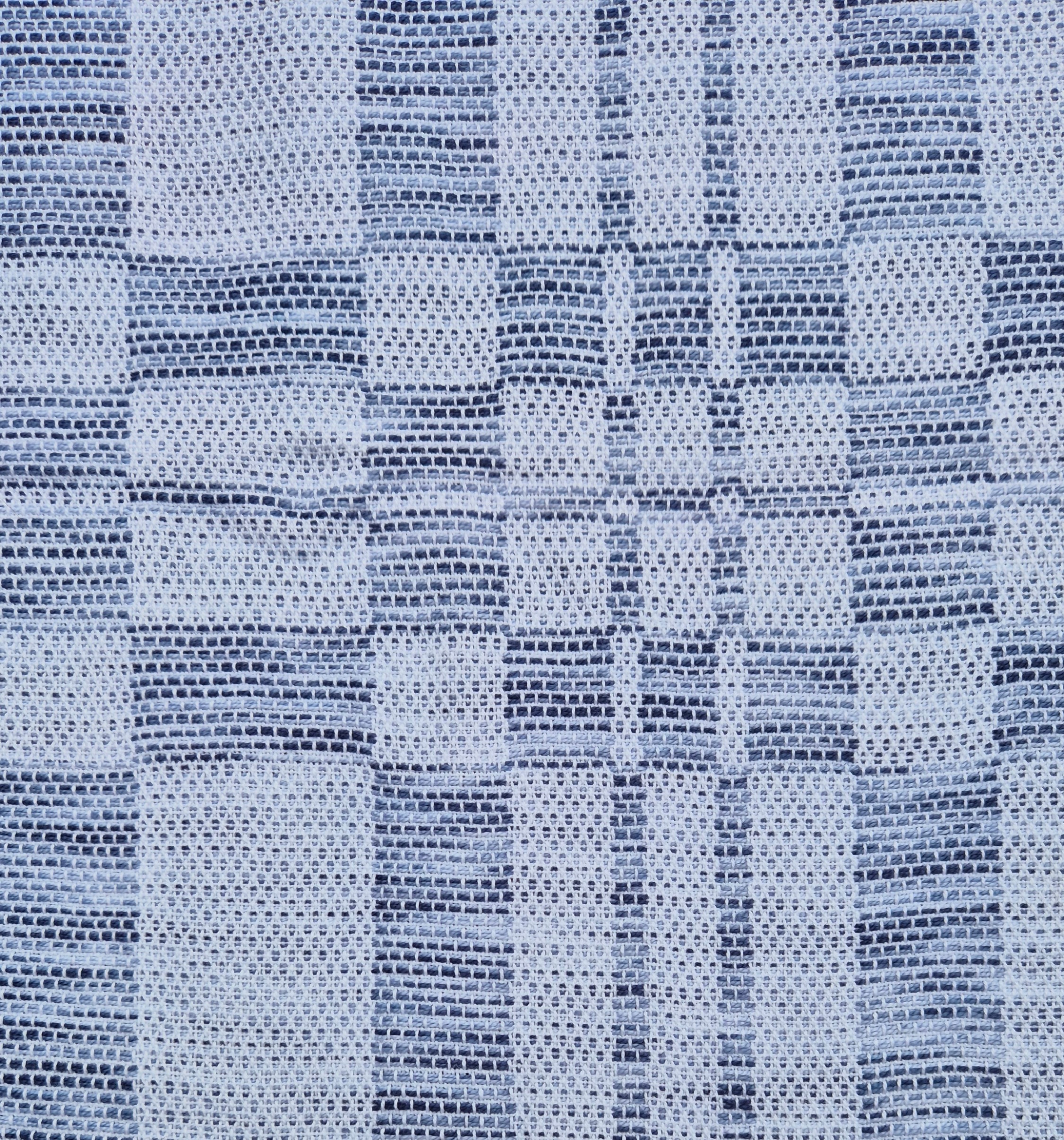 Close-up van de X-zijde van het weefsel.